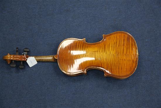 A late 19th / early 20th violin, length of back 14in., together with case and bow